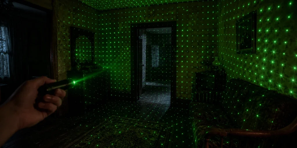 Green laser grid projected across a haunted room during a paranormal investigation